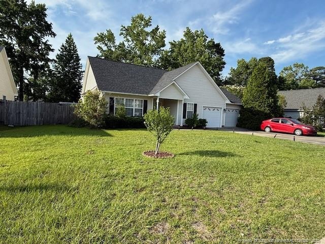 5516 Hall Glen Dr, Hope Mills, NC 28348 - view of front of home with an attached garage and driveway