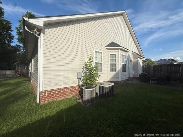 5516 Hall Glen Dr, Hope Mills, NC 28348 - view of home's exterior with central AC unit