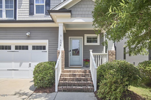 554 Beacon Ridge Blvd, Chapel Hill, NC 27516 - doorway to property featuring an attached garage and a porch
