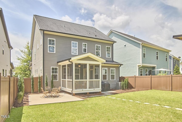 554 Beacon Ridge Blvd, Chapel Hill, NC 27516 - rear view of property with a sunroom, a fenced backyard, a patio, and a shingled roof