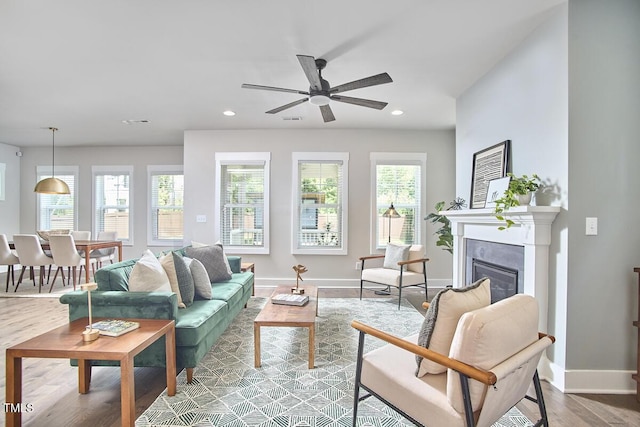 554 Beacon Ridge Blvd, Chapel Hill, NC 27516 - living room featuring wood finished floors, recessed lighting, ceiling fan, and a glass covered fireplace