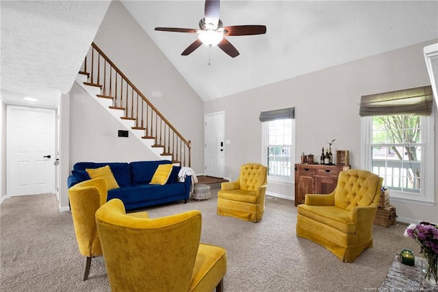 6745 Foxberry Rd, Fayetteville, NC 28314 - living room featuring carpet, stairs, a ceiling fan, baseboards, and high vaulted ceiling
