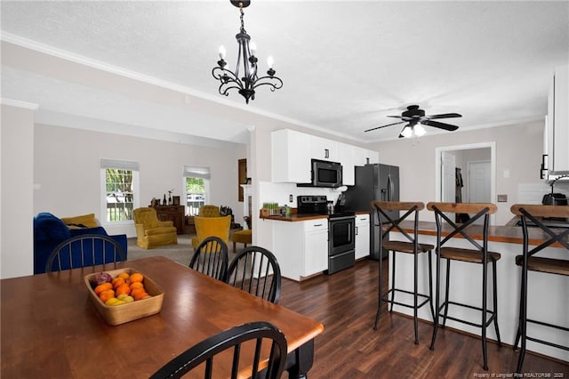 6745 Foxberry Rd, Fayetteville, NC 28314 - dining area featuring dark wood-style flooring, a chandelier, ornamental molding, and a ceiling fan