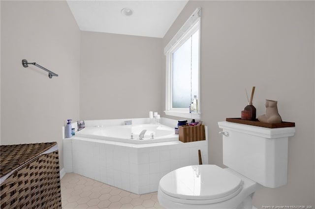 6745 Foxberry Rd, Fayetteville, NC 28314 - full bathroom with toilet, a garden tub, and tile patterned floors