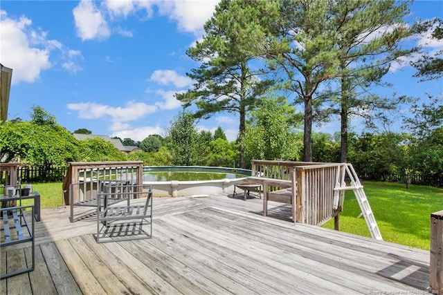 6745 Foxberry Rd, Fayetteville, NC 28314 - wooden terrace with a yard and view of wooded area