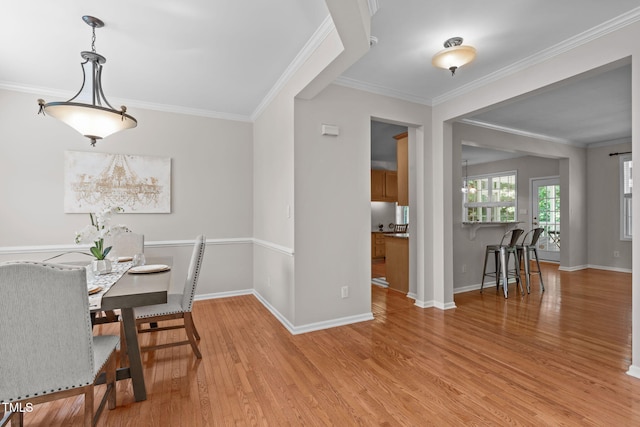 4804 Carmen Ln, Durham, NC 27707 - dining area with light wood-style floors and crown molding