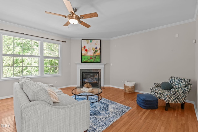 4804 Carmen Ln, Durham, NC 27707 - living area featuring wood finished floors, ceiling fan, crown molding, and a tile fireplace