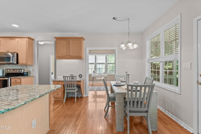 4804 Carmen Ln, Durham, NC 27707 - dining space featuring light wood finished floors, a chandelier, and recessed lighting