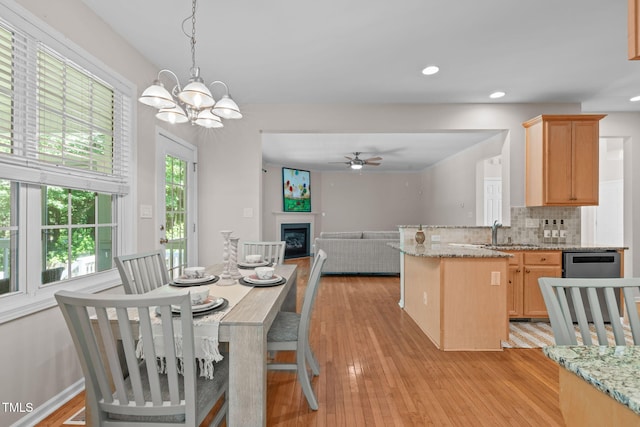 4804 Carmen Ln, Durham, NC 27707 - dining space featuring a ceiling fan, light wood finished floors, recessed lighting, and a chandelier