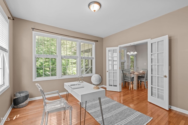 4804 Carmen Ln, Durham, NC 27707 - home office with a chandelier, plenty of natural light, and light wood-style floors