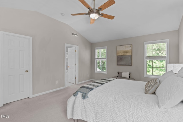 4804 Carmen Ln, Durham, NC 27707 - bedroom featuring vaulted ceiling, light carpet, connected bathroom, and a ceiling fan