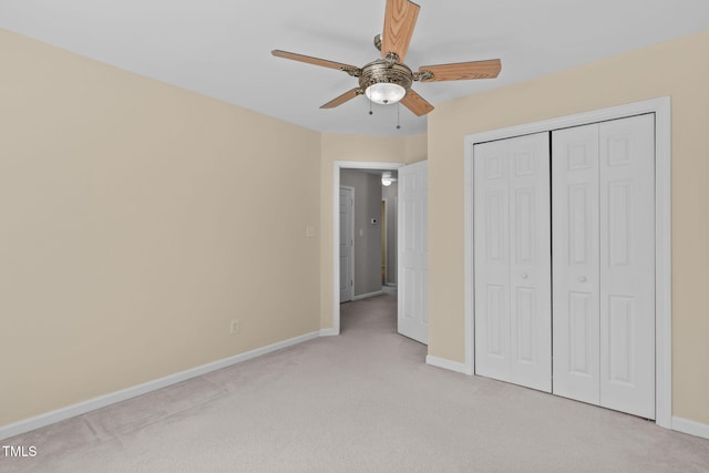 4804 Carmen Ln, Durham, NC 27707 - unfurnished bedroom with carpet, a closet, and a ceiling fan