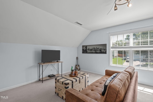 4804 Carmen Ln, Durham, NC 27707 - carpeted living area featuring lofted ceiling and healthy amount of natural light