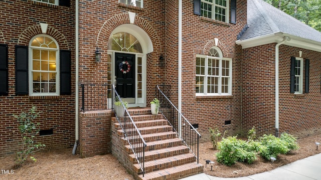 603 Edburton Ct, Hillsborough, NC 27278 - view of exterior entry featuring brick siding, roof with shingles, and crawl space