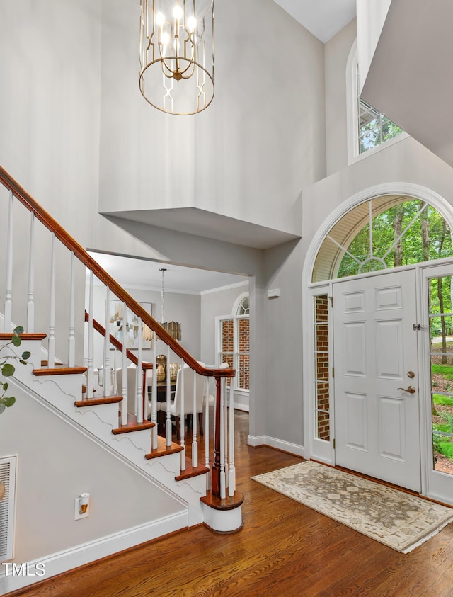 603 Edburton Ct, Hillsborough, NC 27278 - entrance foyer with a chandelier, a high ceiling, wood finished floors, and plenty of natural light