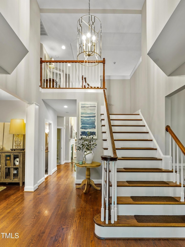 603 Edburton Ct, Hillsborough, NC 27278 - stairway with wood finished floors, a high ceiling, recessed lighting, and a chandelier