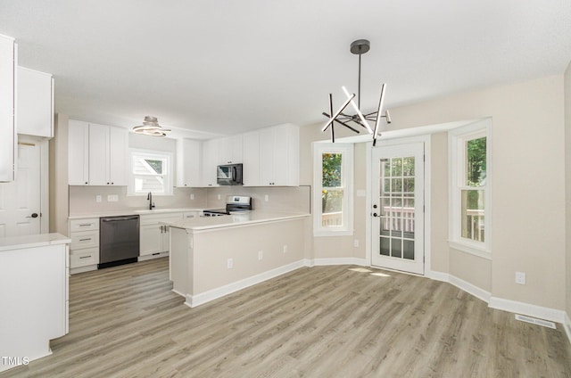 2324 Dahlgreen Rd, Raleigh, NC 27615 - kitchen featuring appliances with stainless steel finishes, light wood-style flooring, light countertops, and white cabinets