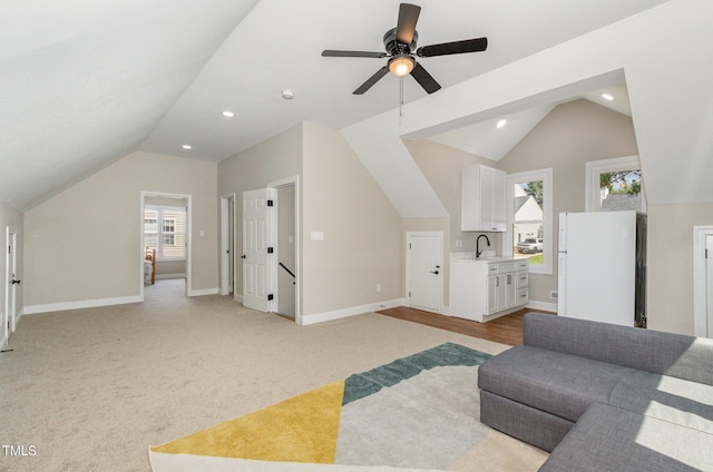 2324 Dahlgreen Rd, Raleigh, NC 27615 - living area with vaulted ceiling, ceiling fan, recessed lighting, and light colored carpet