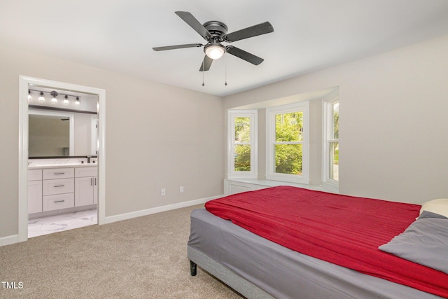 2324 Dahlgreen Rd, Raleigh, NC 27615 - bedroom with light colored carpet, ensuite bathroom, and a ceiling fan