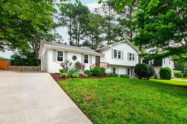 433 Rosehaven Dr, Raleigh, NC 27609 - tri-level home featuring driveway and brick siding