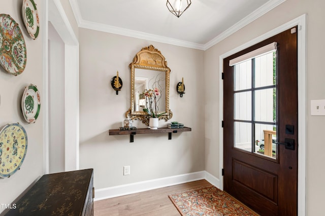 433 Rosehaven Dr, Raleigh, NC 27609 - entrance foyer featuring wood finished floors and ornamental molding