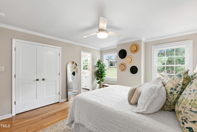 433 Rosehaven Dr, Raleigh, NC 27609 - bedroom featuring light wood finished floors, crown molding, multiple windows, and a ceiling fan