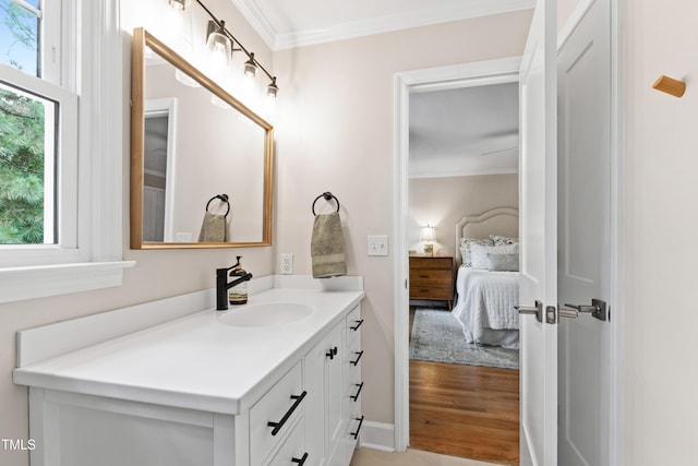 433 Rosehaven Dr, Raleigh, NC 27609 - ensuite bathroom featuring vanity, healthy amount of natural light, crown molding, and wood finished floors