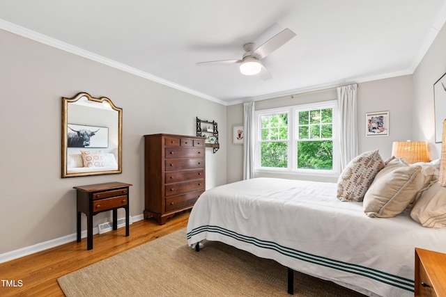 433 Rosehaven Dr, Raleigh, NC 27609 - bedroom featuring wood finished floors, crown molding, and ceiling fan