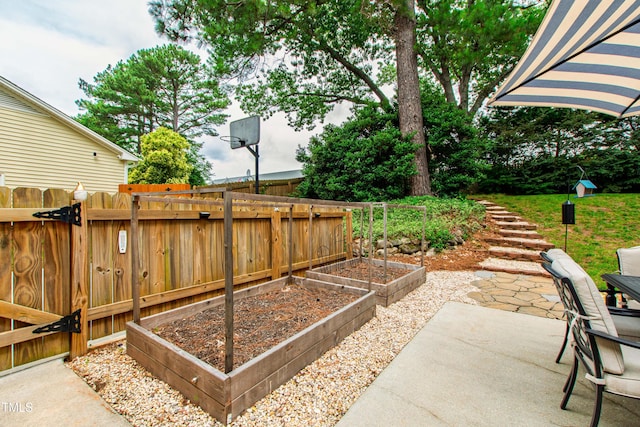 433 Rosehaven Dr, Raleigh, NC 27609 - view of patio / terrace featuring a vegetable garden