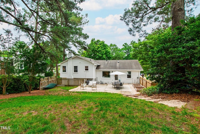 433 Rosehaven Dr, Raleigh, NC 27609 - back of house featuring a patio and a chimney