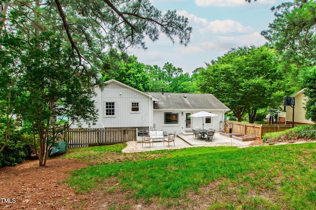 433 Rosehaven Dr, Raleigh, NC 27609 - back of property featuring a patio and roof with shingles