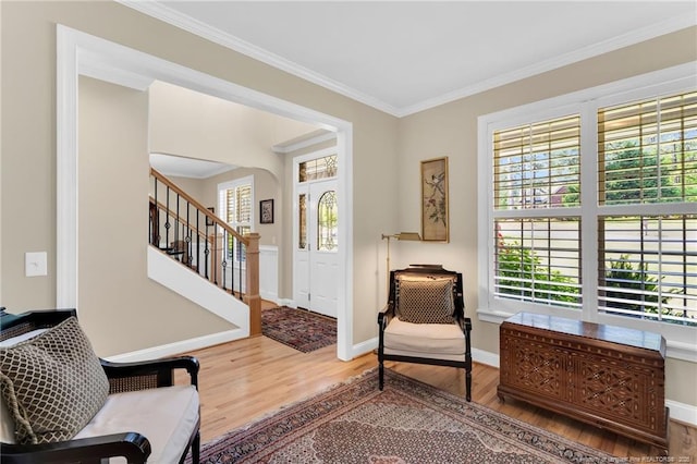 6558 Countryside Dr, Fayetteville, NC 28311 - sitting room featuring wood finished floors, baseboards, crown molding, and stairway