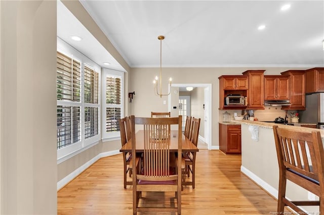 6558 Countryside Dr, Fayetteville, NC 28311 - dining room featuring light wood-style flooring, baseboards, a chandelier, recessed lighting, and ornamental molding
