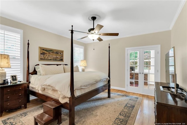 6558 Countryside Dr, Fayetteville, NC 28311 - bedroom featuring french doors, light wood-style floors, crown molding, ceiling fan, and baseboards