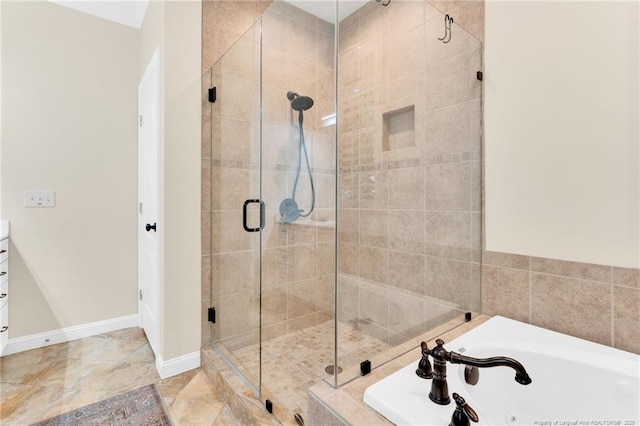 6558 Countryside Dr, Fayetteville, NC 28311 - full bathroom featuring a stall shower, a jetted tub, baseboards, and vanity