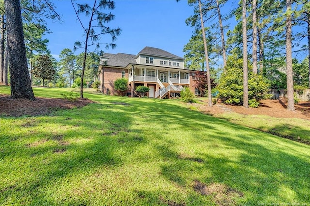 6558 Countryside Dr, Fayetteville, NC 28311 - back of house featuring stairs, a lawn, and a porch