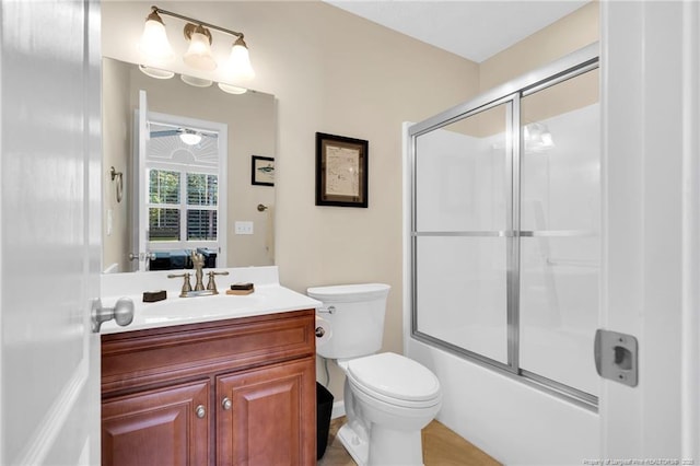 6558 Countryside Dr, Fayetteville, NC 28311 - bathroom featuring vanity, toilet, and combined bath / shower with glass door