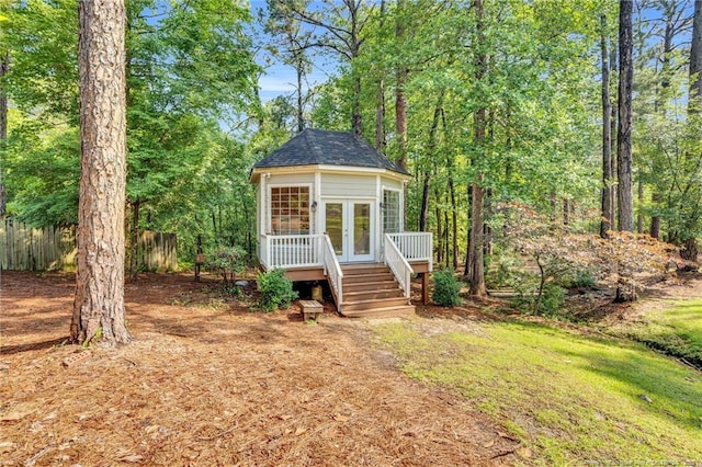 6558 Countryside Dr, Fayetteville, NC 28311 - view of front of property with a deck, french doors, stairs, and roof with shingles