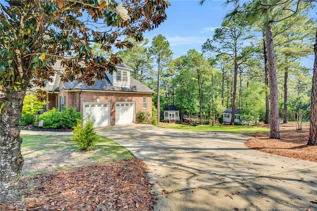 6558 Countryside Dr, Fayetteville, NC 28311 - view of front of house featuring brick siding, concrete driveway, and a garage