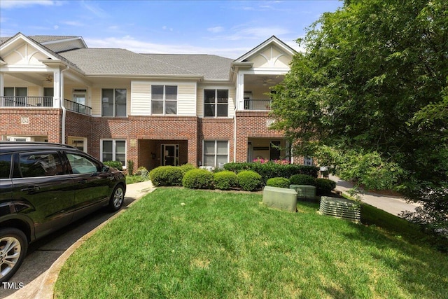 800 Savannah Ridge Rd Unit 109, Holly Springs, NC 27540 - multi unit property featuring brick siding, a front lawn, and a balcony