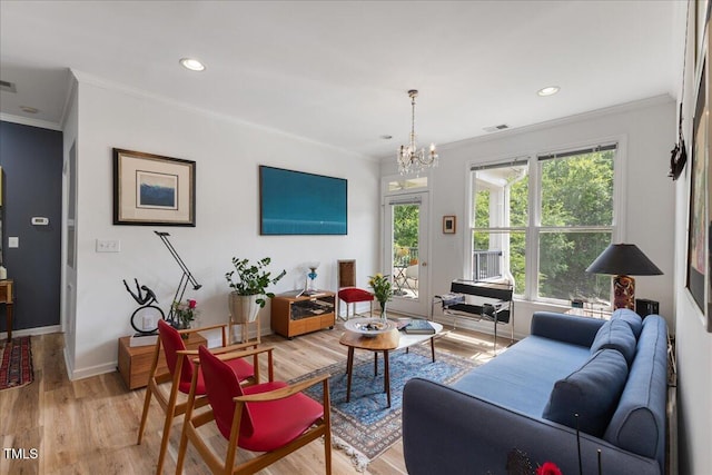 800 Savannah Ridge Rd Unit 109, Holly Springs, NC 27540 - living area featuring crown molding, light wood-type flooring, a chandelier, and recessed lighting