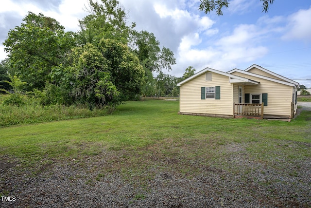 306 W Main St, Pine Level, NC 27568 - view of grassy yard with a deck