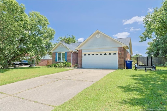 104 Blue Jay Ct, Fayetteville, NC 28306 - single story home with a garage, driveway, and brick siding