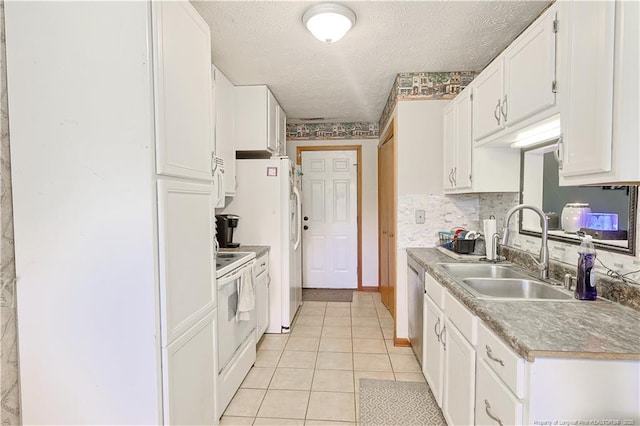104 Blue Jay Ct, Fayetteville, NC 28306 - kitchen with a sink, electric stove, light tile patterned flooring, white cabinetry, and a textured ceiling