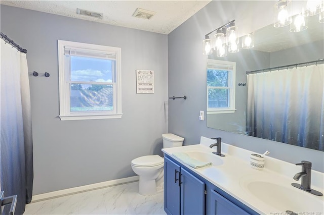 104 Blue Jay Ct, Fayetteville, NC 28306 - bathroom with double vanity, toilet, marble finish flooring, a shower with shower curtain, and baseboards