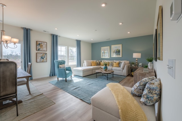 303 Enfield Dr, Carthage, NC 28327 - living room featuring a chandelier, light wood finished floors, recessed lighting, and baseboards