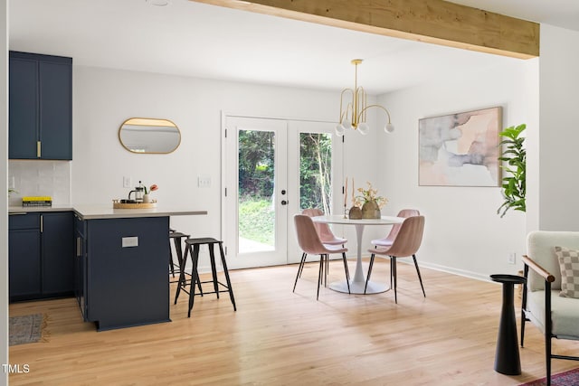 939 Clarion Dr, Durham, NC 27705 - dining space with light wood-style flooring and a chandelier