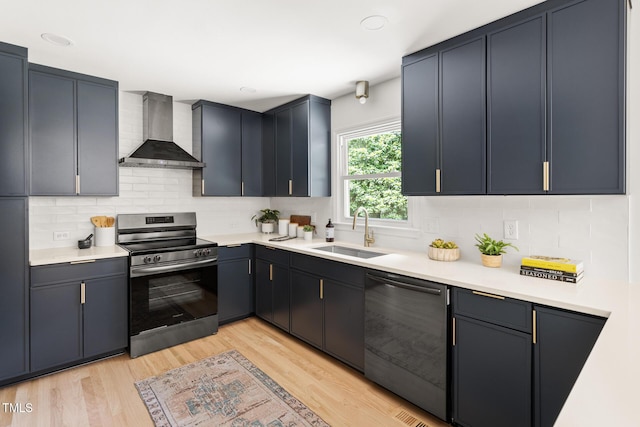 939 Clarion Dr, Durham, NC 27705 - kitchen with wall chimney range hood, stainless steel range with electric cooktop, dishwasher, light countertops, and light wood-style flooring