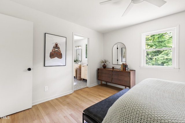 939 Clarion Dr, Durham, NC 27705 - bedroom featuring light wood finished floors, connected bathroom, and a ceiling fan
