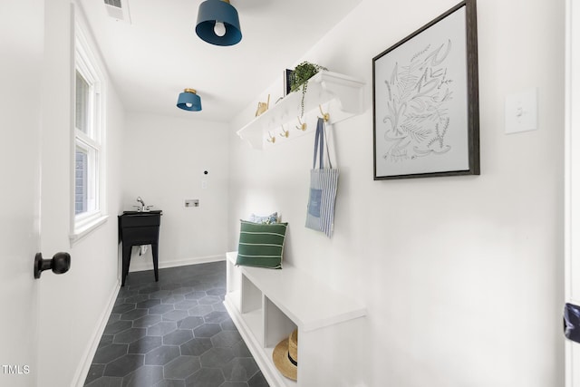 939 Clarion Dr, Durham, NC 27705 - mudroom with dark tile patterned flooring and baseboards
